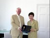 Secretary for Development, Mrs Carrie Lam, presents a souvenir to the Chairman of the Covent Garden Area Trust, Mr Raymond Cooper.