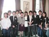 The Secretary for Development, Mrs Carrie Lam, with a group of Hong Kong students studying in the UK.