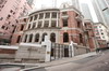 The Kom Tong Hall in Central has been declared a monument under the Antiquities and Monuments Ordinance. Kom Tong Hall was built in the Edwardian classical style, featuring red brick walls, granite dressings around windows and doors, and ornate ironwork on balconies.