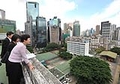 The Secretary for Development, Mrs Carrie Lam, was briefed by Planning Department officer on the roof of the former headquarters of the Electrical and Mechanical Services Department about land use planning issues in the Caroline Hill area.
