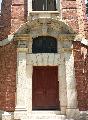 Decorative entrance of the Signal Tower with segmental arch, pediment, keystone and pilasters.