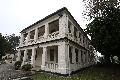 The east and south facades of Block 25 at the old Lei Yue Mun Barracks with open colonnaded and balustraded verandahs, supported by square brick columns with simple bases and capitals.