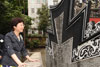 The Secretary for Development, Mrs Carrie Lam, inspects the repaired roof tiles of the Lo Pan Temple.