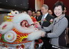 Mrs Carrie Lam performs an eye-dotting ceremony for the lion dance.Mrs Carrie Lam performs an eye-dotting ceremony for the lion dance.