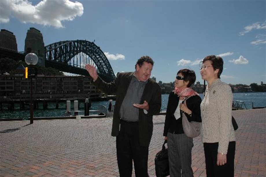 The Secretary for Development, Mrs Carrie Lam, is briefed by the Sydney Harbour Foreshore Authority's archaeologist, Dr Wayne Johnson, on the management of Sydney harbour at the Rocks today (September 24).