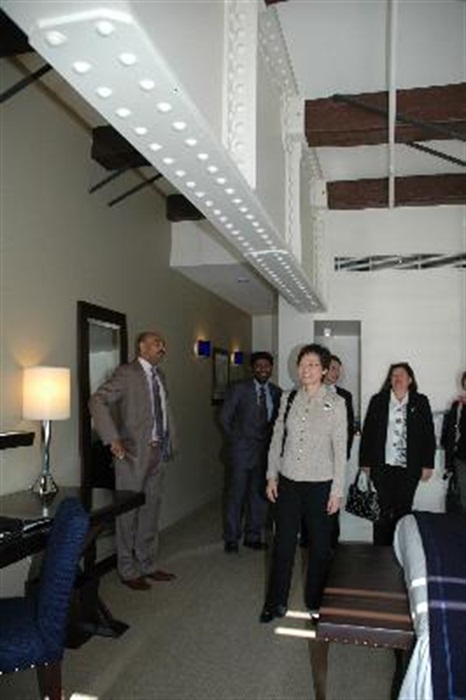 The Secretary for Development, Mrs Carrie Lam, visits a hotel room inside Finger Wharf in Sydney today (September 24). The Wharf, built in 1911 as a timber pile wharf, was successfully preserved and converted into a complex housing restaurants, apartments and a hotel.