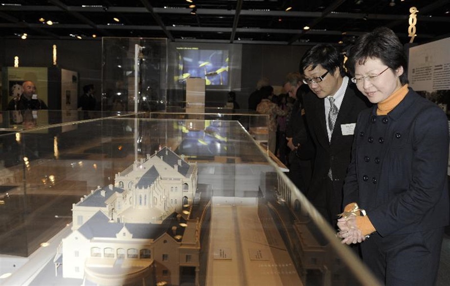 Mrs Carrie Lam, views a model of Bethanie in the "Heritage Alive: UNESCO Culture Heritage Awards" Exhibition. Accompanying Mrs Lam is the Commissioner for Heritage, Mr Jack Chan.