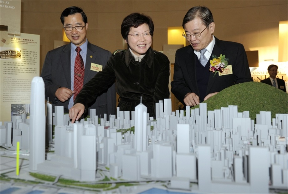 The Secretary for Development, Mrs Carrie Lam, views a 3-D model showing historic buildings and monuments in Central District in the "Conserving Central" Exhibition. With Mrs Lam are Chairman of the Central and Western District Council Mr Chan Tak-chor (right) and and vice-chairman Mr Stephen Chan (left).