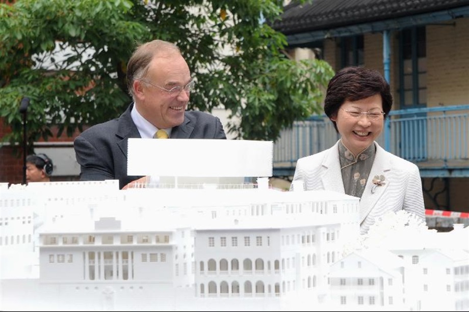The Secretary for Development, Mrs Carrie Lam, and Chairman and Senior Principal of Purcell Miller Tritton, Mr Michael Morrison, view a model showing the revised design of the Central Police Station Compound.