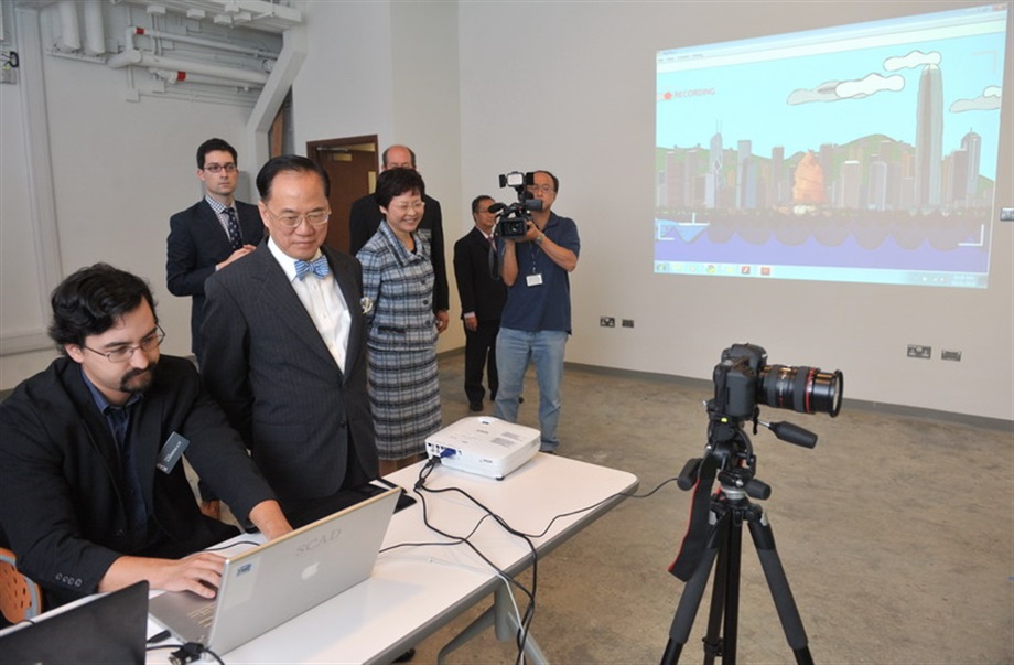 Mr Tsang and Mrs Lam are briefed on how production is done in the green screen motion capture studio.