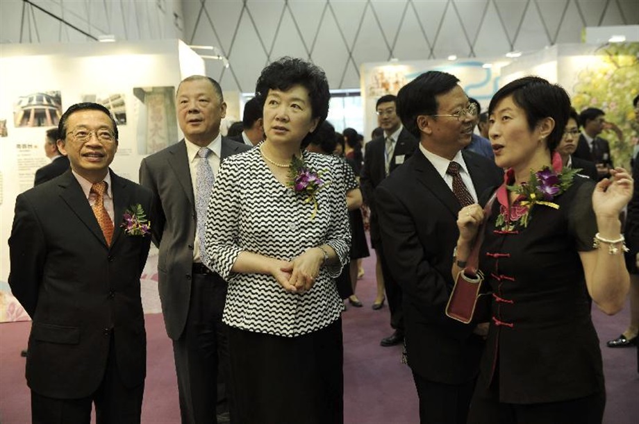 The Office of the Government of the Hong Kong Special Administrative Region (HKSAR) in Beijing today (July 1) organised a cocktail reception to celebrate the 14th anniversary of the establishment of the HKSAR and kickstarted the Hong Kong Heritage Tourism Expo in Beijing. The exhibition is co-organised by the Beijing Office and the Commissioner for Heritage's Office with an aim of introducing to Beijing audience specially designed heritage tour routes in Hong Kong that showcase the city's distinctive cultural history. Picture shows Deputy Director of the Hong Kong and Macao Affairs Office of the State Council, Ms Hua Jian (centre), joining the Director of the Beijing Office, Mr Thomas Tso (first left), and the Commissioner for Heritage, Mrs Laura Aron (first right), to visit the exhibition.