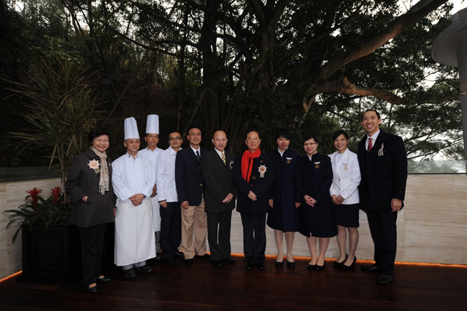 Mr Tsang and Mrs Lam with staff of the Tai O Heritage Hotel.