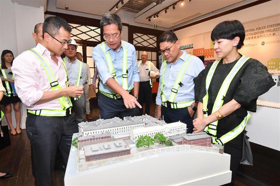 The Secretary for Development, Mr Michael Wong (second left), visited Central and Western District today (August 29) to inspect the progress of works for the revitalisation of the Central Police Station Compound. Picture shows Mr Wong viewing a model of the Compound and being briefed by the Executive Director of Charities and Community of the Hong Kong Jockey Club, Mr Cheung Leong (first left), on the revitalisation project and its development. Looking on are the Chairman of the Central and Western District Council, Mr Yip Wing-shing (second right), and the District Officer (Central and Western), Mrs Susanne Wong (first right).