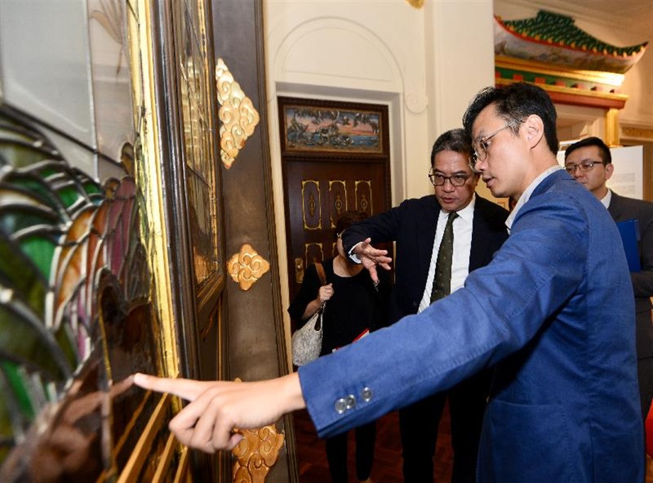 The Secretary for Development, Mr Michael Wong, toured Haw Par Music Farm in the revitalised Haw Par Mansion during his visit to Wan Chai District today (May 31). Photo shows Mr Wong (first left) being briefed by a representative of Haw Par Music Farm on details of the restoration and revitalisation of the Mansion.