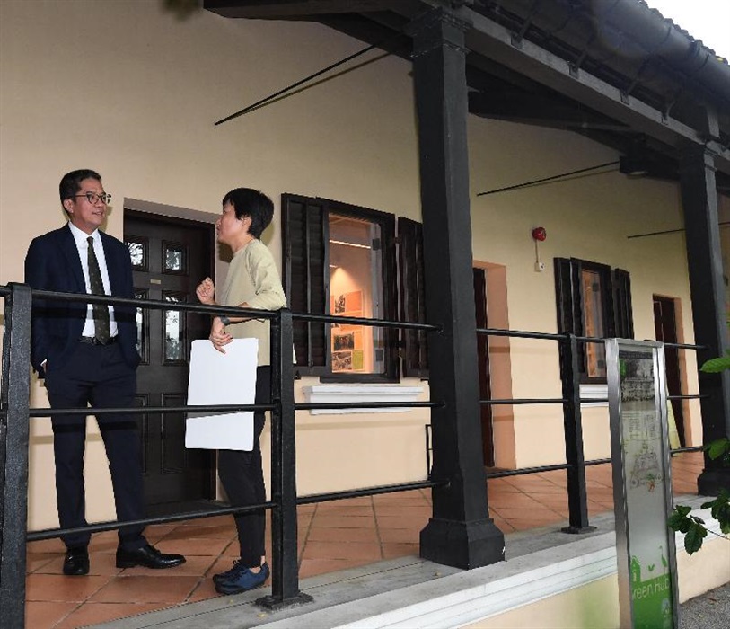 The Secretary for Development, Mr Michael Wong, toured the Green Hub during his visit to Tai Po District today (June 24). Photo shows Mr Wong (left) being briefed by the Head of the Sustainable Living and Agriculture Department of the Kadoorie Farm and Botanic Garden Corporation, Ms Idy Wong (right), on the daily operation of the Green Hub.