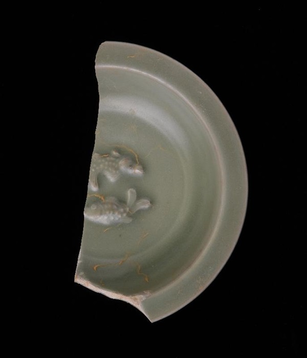An exhibition entitled "Treasures from Sacred Hill: Song-Yuan Period Archaeological Discoveries from Kai Tak", featuring around 200 archaeological finds unearthed at the Kai Tak area, will be open from December 24 until February 26, 2020, at the Hong Kong Heritage Discovery Centre. Photo shows one of the exhibit highlights, a green glazed dish with a moulded double fish pattern produced by Longquan Kiln.