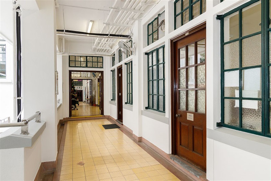 The Government today (July 16) gazetted a notice announcing that the Antiquities Authority (i.e. the Secretary for Development) has declared Bonham Road Government Primary School in Sai Ying Pun, the Old Tai Po Police Station in Tai Po and Hip Tin Temple in Sha Tau Kok as monuments under the Antiquities and Monuments Ordinance. Photo shows the timber doors, steel-framed windows with patterned or plain glass panes, and the old-styled ironmongery of the main building of Bonham Road Government Primary School, which are all well maintained.