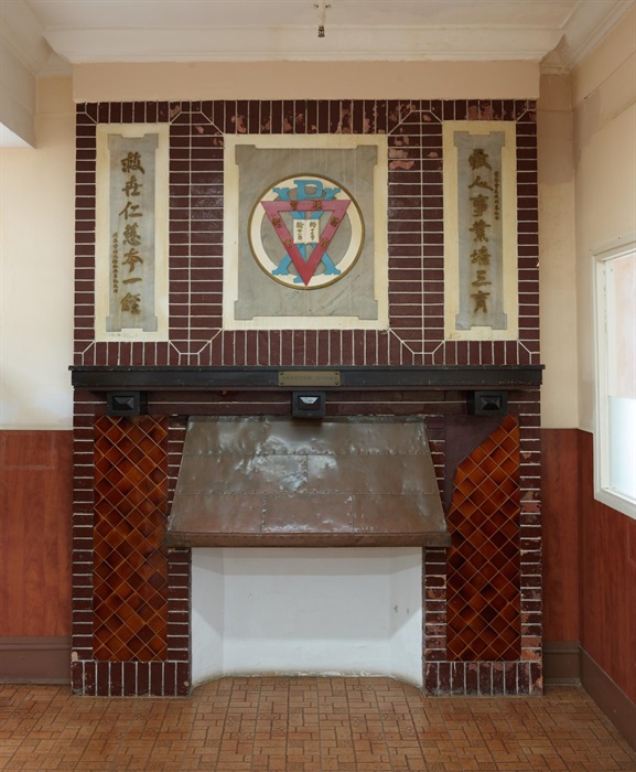 The Government gazetted today (October 20) the declaration of the Chinese YMCA of Hong Kong in Sheung Wan as a monument under the Antiquities and Monuments Ordinance. Photo shows the fireplace on the ground floor of the Chinese YMCA of Hong Kong. The emblem of the YMCA and couplets inscribed on a marble plate and slabs are on top of the mantel.